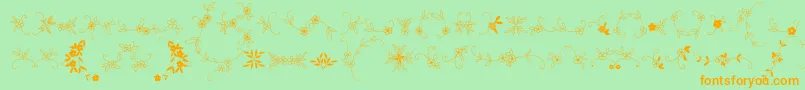 フォントMeninaGraciosaOrnamentsTwo – オレンジの文字が緑の背景にあります。