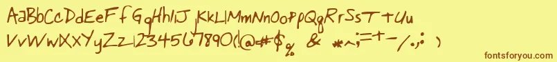 フォントPastorswrit – 茶色の文字が黄色の背景にあります。
