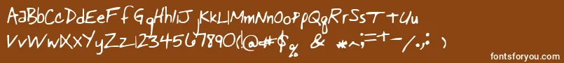 Pastorswrit-fontti – valkoiset fontit ruskealla taustalla