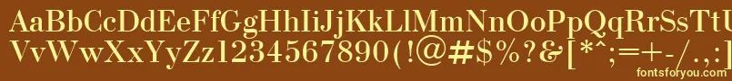 OlgaPlain-fontti – keltaiset fontit ruskealla taustalla