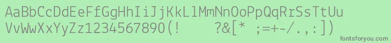 Lekton005L-fontti – harmaat kirjasimet vihreällä taustalla