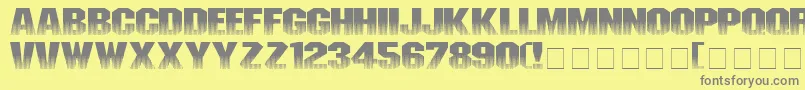 Invisiblekiller-fontti – harmaat kirjasimet keltaisella taustalla