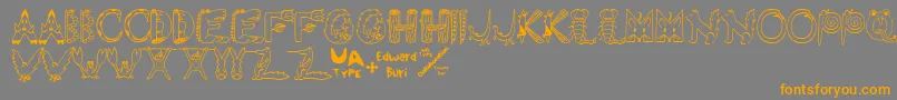 EdbWildThings-Schriftart – Orangefarbene Schriften auf grauem Hintergrund