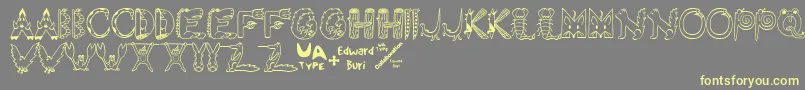 EdbWildThings-Schriftart – Gelbe Schriften auf grauem Hintergrund