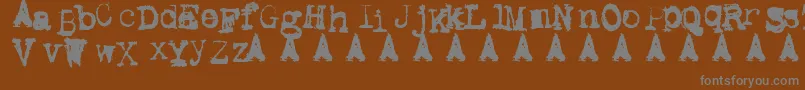 MetalicAvacodo-Schriftart – Graue Schriften auf braunem Hintergrund