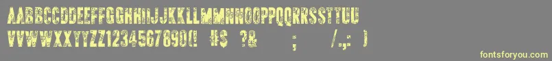 ApAppliqueStitched-Schriftart – Gelbe Schriften auf grauem Hintergrund