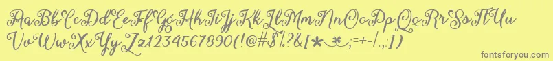 MarchCalligraphyTtf-Schriftart – Graue Schriften auf gelbem Hintergrund
