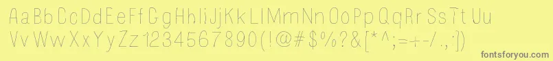 フォントMossy – 黄色の背景に灰色の文字