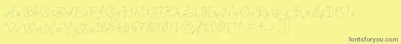 Whimsywischy-fontti – harmaat kirjasimet keltaisella taustalla