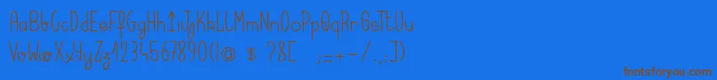 フォントKeralaquest – 茶色の文字が青い背景にあります。