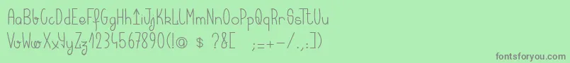 フォントKeralaquest – 緑の背景に灰色の文字