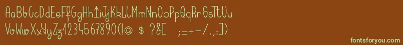 フォントKeralaquest – 緑色の文字が茶色の背景にあります。