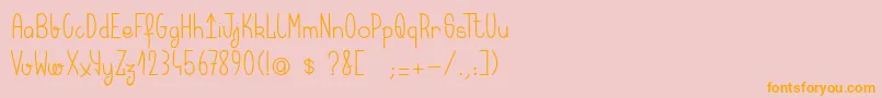 フォントKeralaquest – オレンジの文字がピンクの背景にあります。