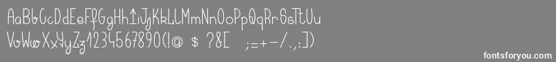 フォントKeralaquest – 灰色の背景に白い文字