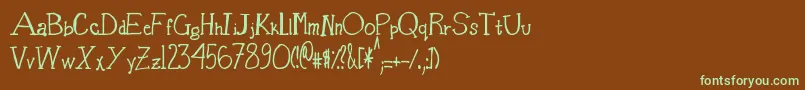 フォントBasketOfCandy – 緑色の文字が茶色の背景にあります。