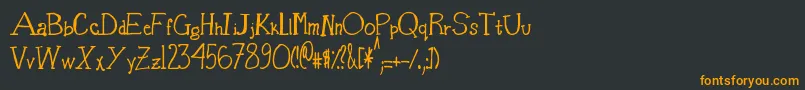 フォントBasketOfCandy – 黒い背景にオレンジの文字