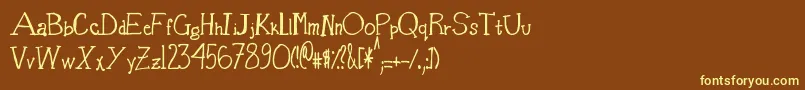 BasketOfCandy-fontti – keltaiset fontit ruskealla taustalla