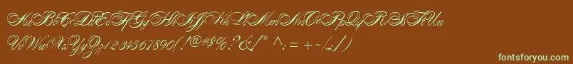 フォントAlexandraScript – 緑色の文字が茶色の背景にあります。