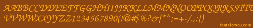 フォントThahuongh1.1 – オレンジ色の文字が茶色の背景にあります。